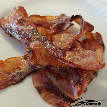 Image of Cooked Bacon (Pork, Rendered Fat) that contains eicosatetraenoic acid, ETA (20:4)