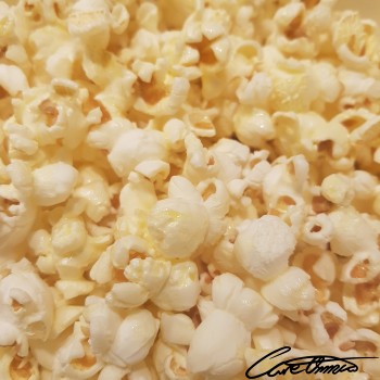 Image of Popcorn (With Added Butter Or Margarine, Popped In Oil) that contains linolenic acid  (18:3)