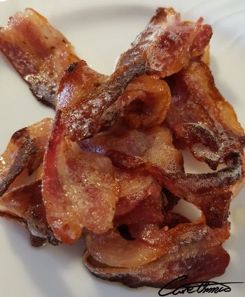 Cooked bacon on a plate