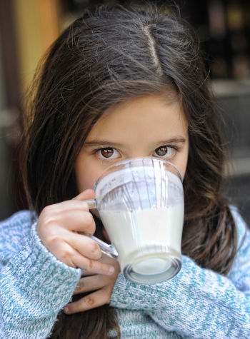 Care Omnia Girl Drinking Milk
