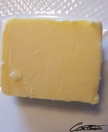 A piece of butter on a plate