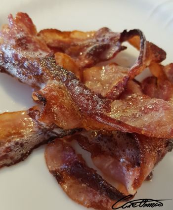 Some cooked bacon on a plate