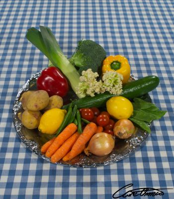 A platter of different kinds of vegetables set on a table