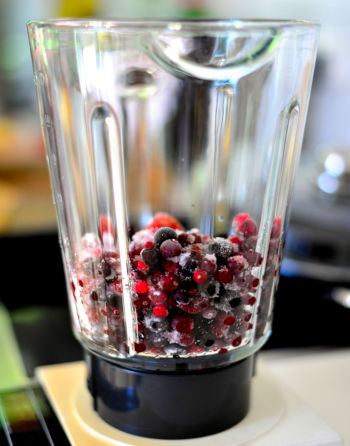 Care Omnia Smoothie in the making with Lingonberries and blueberries