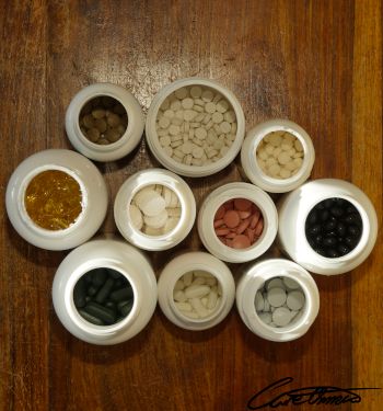 Top down view on a collection of opened cans of supplements