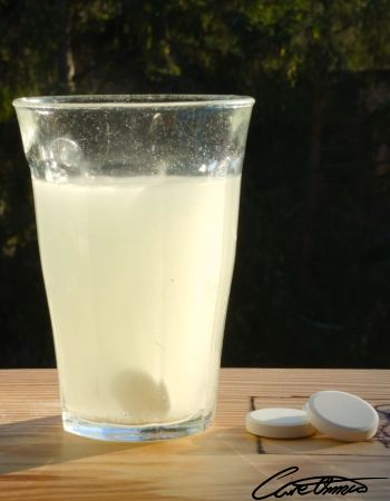 Glas of water with a vitamin c effervescent tablet in it