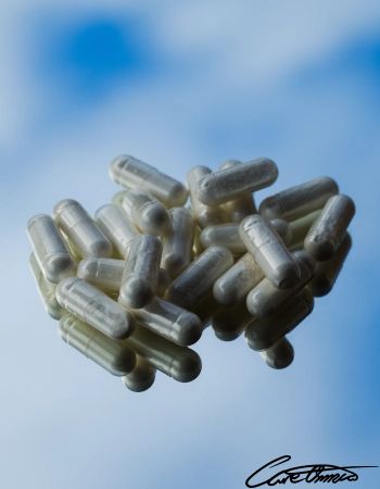 Zinc supplements on a mirror with sky background