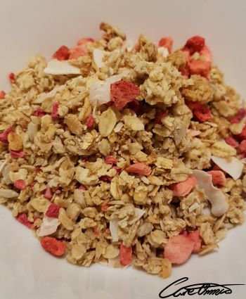 Granola with dried fruits in a breakfast bowl